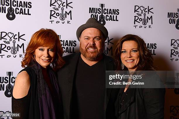 Reba McEntire, Shane Tarleton, and Martina McBride on the red carpet at the Musicians on Call event at City Winery Nashville on October 21, 2015 in...