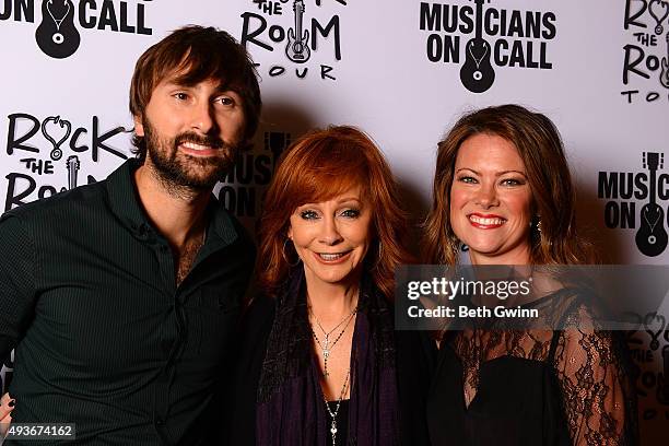 Dave Haywood, Reba McEntire, and Kelli Cashiola on the red carpet before the Musicians on Call event at City Winery Nashville on October 21, 2015 in...