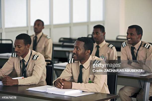 Junior Ethiopian pilots listen to a lesson in a classroom on the campus of the Ethiopian Airlines flight academy in Addis Ababa on October 13, 2015....