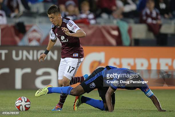 Dillon Serna of the Colorado Rapids is fouled by Patrice Bernier of the Montreal Impact at Dick's Sporting Goods Park on May 24, 2014 in Commerce...