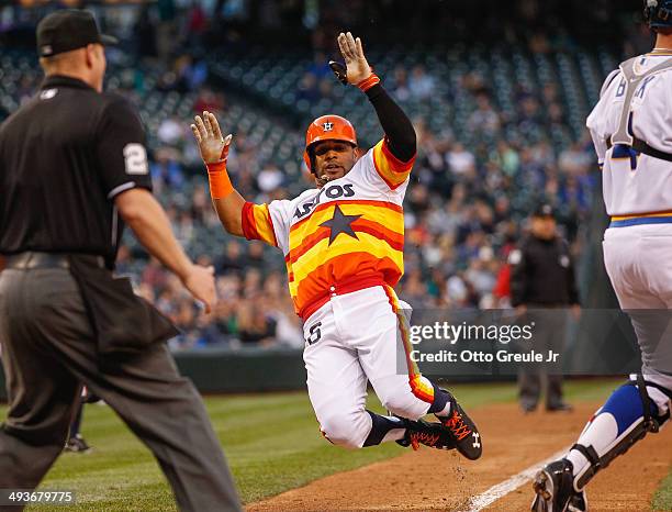 Jonathan Villar of the Houston Astros scores on a single by Jose Altuve in the fifth inning against the Seattle Mariners at Safeco Field on May 24,...