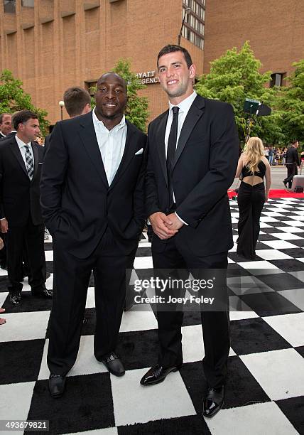 Football players for the Indianapolis Colts Robert Mathis and Andrew Luck attend the 2014 Indy 500 Snakepit Ball during the 2014 Indy 500 Festival at...