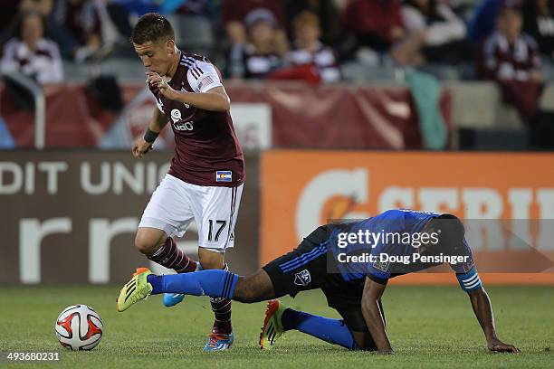 Dillon Serna of the Colorado Rapids is fouled by Patrice Bernier of the Montreal Impact at Dick's Sporting Goods Park on May 24, 2014 in Commerce...