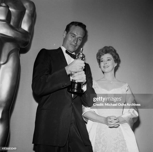 Actor Charlton Heston poses with Susan Hayward after winning the Academy Award for "Ben Hur" in Los Angeles, California.
