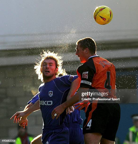 Darren Ward of Millwall outjumps Jason De Vos of Ipswich during the Coca Cola Championship match between Ipswich Town v Millwall at Portman Road on...