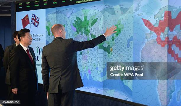 Chinese President Xi Jinping views satellite coverage screens in the Network Operation Centre control room with Rupert Pearce, CEO of Inmarsat during...