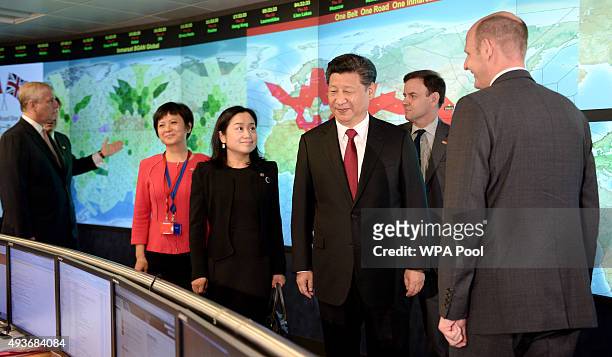Chinese President Xi Jinping views satellite coverage screens in the Network Operation Centre control room with Rupert Pearce, CEO of Inmarsat and...