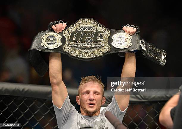 Dillashaw celebrates after defeating Renan Barao in their bantamweight championship bout during the UFC 173 event at the MGM Grand Garden Arena on...
