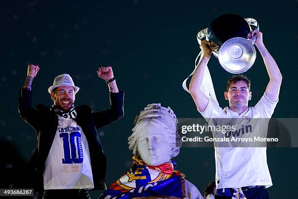 Captain goalkeeper Iker Casillas of Real Madrid CF holds the UEFA Champions League cup celebrating with his teammate Sergio Ramos their victory on...