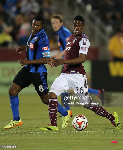 Edson Buddle of the Colorado Rapids controls the ball against Patrice Bernier of the Montreal Impact at Dick's Sporting Goods Park on May 24, 2014 in...