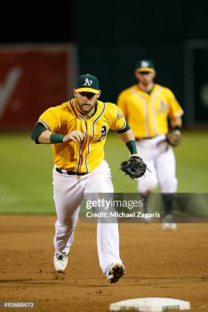 Daric Barton of the Oakland Athletics covers first during the game against the Seattle Mariners at O.co Coliseum on May 5, 2014 in Oakland,...