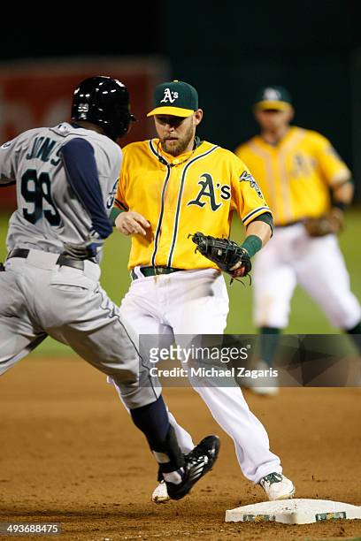 Daric Barton of the Oakland Athletics covers first during the game against the Seattle Mariners at O.co Coliseum on May 5, 2014 in Oakland,...