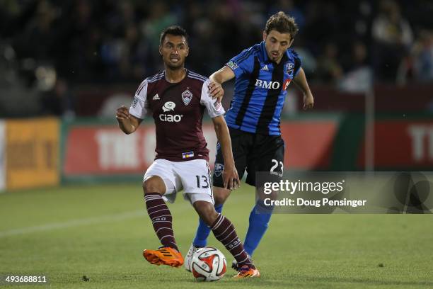 Kamani Hill of the Colorado Rapids controls the ball against Hernan Bernardello of the Montreal Impact at Dick's Sporting Goods Park on May 24, 2014...