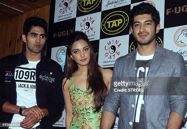 Indian Bollywood actors Vijender Singh , Kiara Advani and Mohit Marwah pose for a photograph during a promotional event for the forthcoming Hindi...