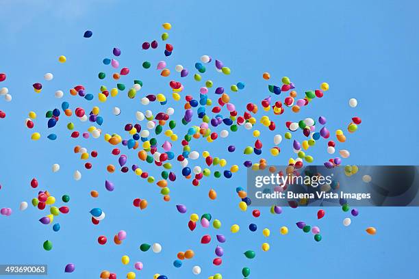 colorful balloons in blue sky - balloon sky stock pictures, royalty-free photos & images