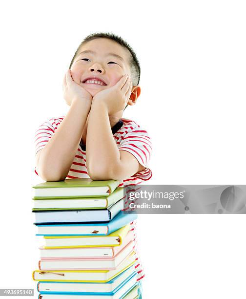 asian boy with stack of books - small person looking up stock pictures, royalty-free photos & images