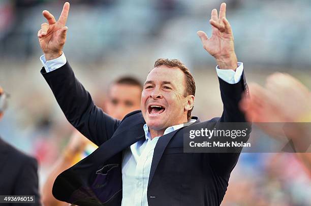 Raiders coach Ricky Stuart celebrates a try by his team during the round 11 NRL match between the Canberra Raiders and the North Queensland Cowboys...