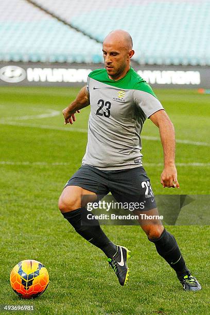 Mark Bresciano of Australia controls a ball during an Australian Socceroos training session at ANZ Stadium on May 25, 2014 in Sydney, Australia.