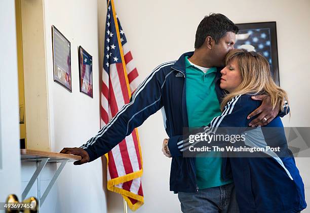 Bangladesh-born Zunu Zunaid and american wife Madina Salaty wait at an immigration contractor's office to get his ankle monitor removed a day before...