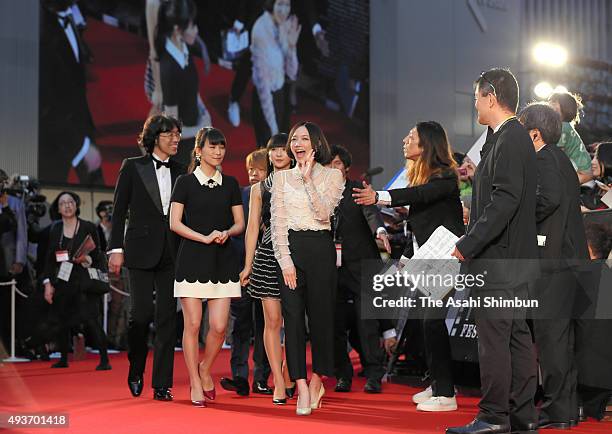 Members of music group Perfume walk on the red carpet during the opening ceremony of the Tokyo International Film Festival at Roppongi Hills on...