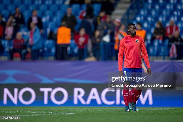 Jackson Arley Martinez of Atletico de Madrid leaves the picth ahead the Uefa No to Racism logo displayed on a screen after his warming up before the...