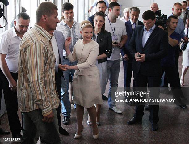 Ukrainian presidential candidate Yulia Tymoshenko arrives to cast her ballot, alongside her daughter Yevhenia , at a polling station in...