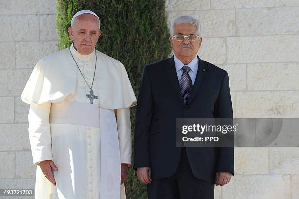 In this handout image supplied by the Palestinian Press Ofiice Palestinian President Mahmoud Abbas stands with Pope Francis during a welcoming...