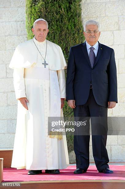 In this handout image supplied by the Palestinian Press Ofiice Palestinian President Mahmoud Abbas stands with Pope Francis during a welcoming...