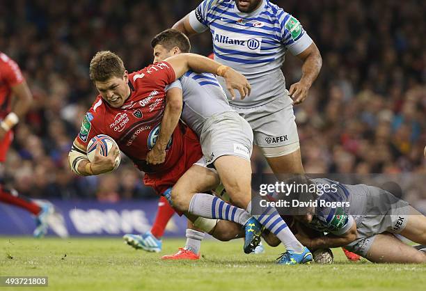 Juan Smith of Toulon is tackled by Richard Wigglesworth during the Heineken Cup Final between Toulon and Saracens at the Millennium Stadium on May...