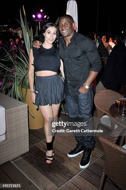 Lilit Avagyan and Reggie Bush onboard the Red Bull Energy Station ahead of the Monaco Formula One Grand Prix at Circuit de Monaco on May 24, 2014 in...