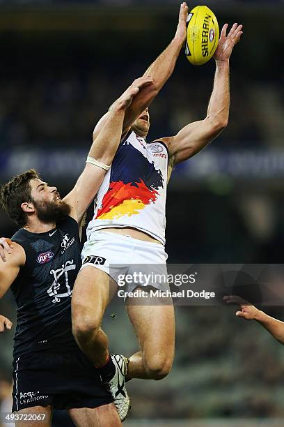 James Podsiadly of the Crows competes for the ball against Levi Casboult of the Blues during the round 10 AFL match between the Carlton Blues and the...