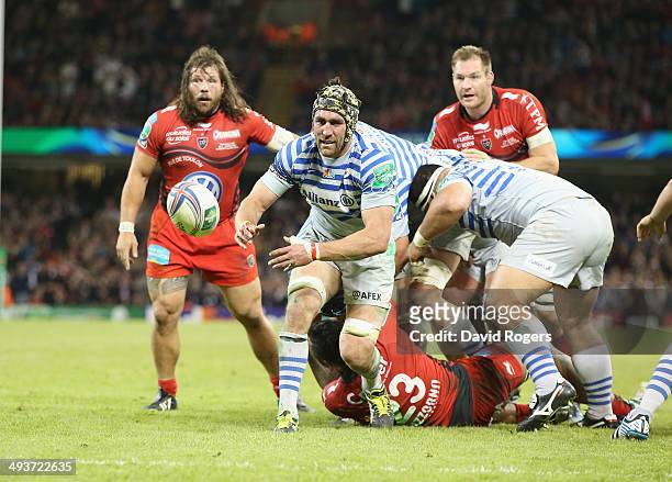 Kelly Brown of Saracens passes the ball during the Heineken Cup Final between Toulon and Saracens at the Millennium Stadium on May 24, 2014 in...