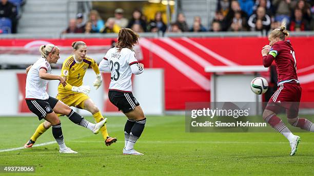 Mandy Islacker of Germany scores her team's first goal against goalkeeper Elvira Todua of Russia during the UEFA Women's Euro 2017 Qualifier match...