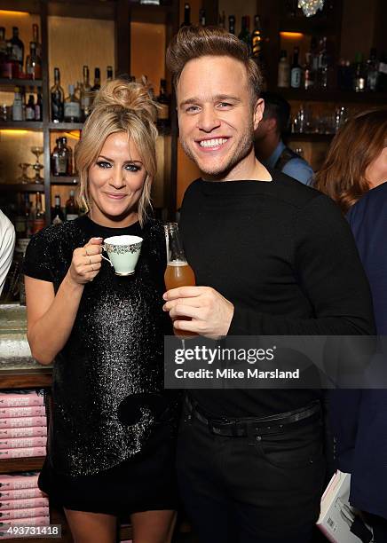 Caroline Flack and Olly Murs attend the launch of Caroline Flack's new autobiography "Storm In A C Cup" at Library on October 21, 2015 in London,...