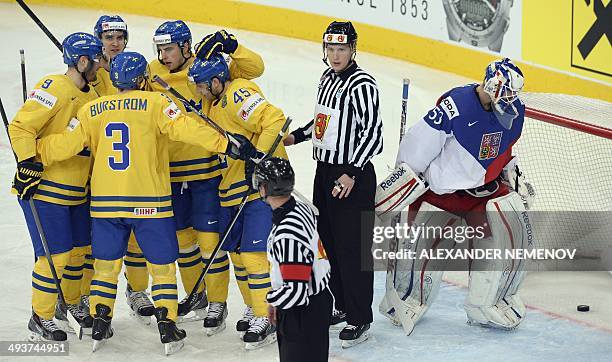 Sweden's palyers celebrate a goal past Czech Republic's goalie Alexander Salak during a bronze medal game Czech Republic vs Sweden of the IIHF...