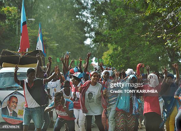 Opposition supporters dance within a political rally of the Civic United Front presidential candidate for Zanzibar, Maalim Seif Sharif Hamad on...