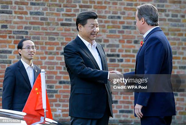 British Prime Minister David Cameron welcomes Chinese President Xi Jinping to his official residence at Chequers on October 22, 2015 in Aylesbury,...