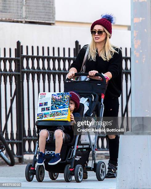 Hilary Duff is seen taking her son Luca Cruz Comrie to a toy shop on October 21, 2015 in New York City.