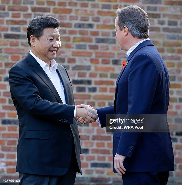 British Prime Minister David Cameron welcomes Chinese President Xi Jinping to his official residence at Chequers on October 22, 2015 in Aylesbury,...