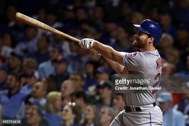 Daniel Murphy of the New York Mets hits a two run home run in the eighth inning against Fernando Rodney of the Chicago Cubs during game four of the...