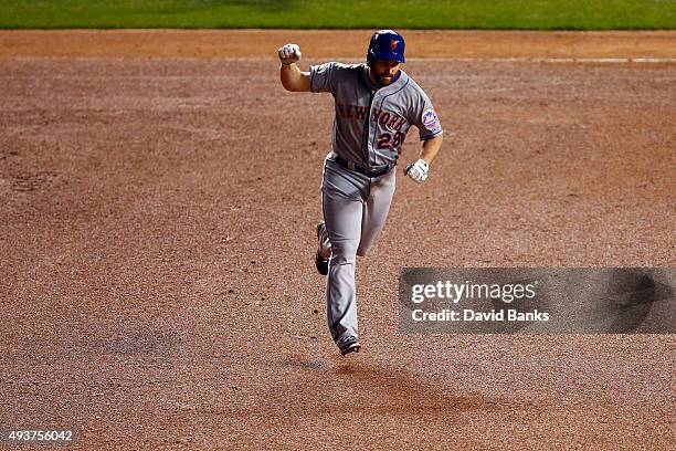 Daniel Murphy of the New York Mets rounds the bases after hitting a two run home run in the eighth inning against Fernando Rodney of the Chicago Cubs...