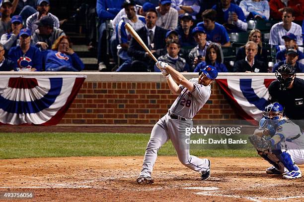 Daniel Murphy of the New York Mets hits a two run home run in the eighth inning against Fernando Rodney of the Chicago Cubs during game four of the...