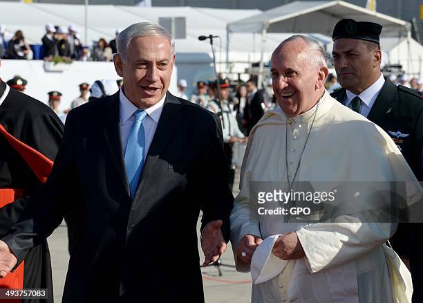 In this handout provided by the Israeli Government Press Office , Pope Francis walks with Prime Minister of Israel Benjamin Netanyahu during a...