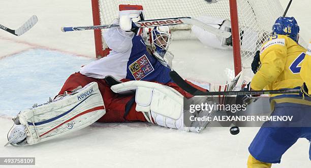 Sweden's forward Oscar Moller attacks Czech Republic's goalie Alexander Salak during a bronze medal game Czech Republic vs Sweden of the IIHF...