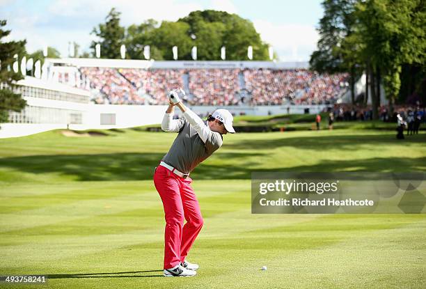 Rory McIlroy of Northern Ireland hits his 2nd shot on the 18th hole during day four of the BMW PGA Championship at Wentworth on May 25, 2014 in...