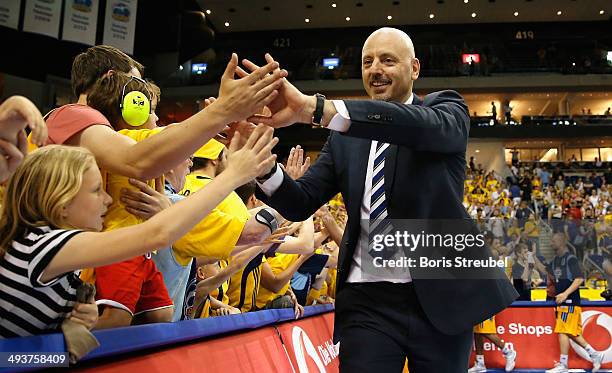 Coach Sasa Obradovic of Berlin celebrates with his fans after winning the Beko Basketball Bundesliga first leg playoff semi-final match between ALBA...