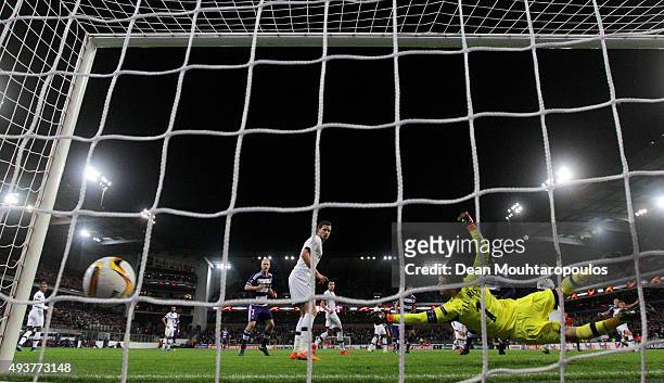Hugo Lloris of Spurs dives in vain as Guillaume Gillet of Anderlecht scores a goal to level the scores at 1-1 during the UEFA Europa League Group J...
