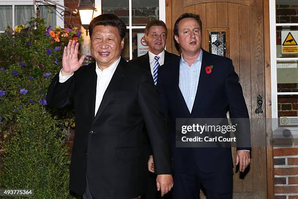 Prime Minister David Cameron leaves The Plough pub with China's president Xi Jinping on October 22, 2015 in Princes Risborough, England. The...