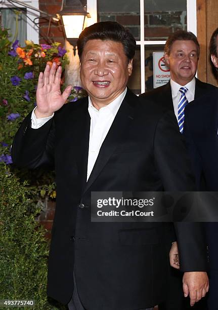 China's president Xi Jinping waves as he leaves The Plough pub on October 22, 2015 in Princes Risborough, England. The President of the People's...