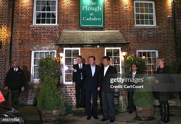 Prime Minister David Cameron leaves The Plough pub with China's president Xi Jinping on October 22, 2015 in Princes Risborough, England. The...